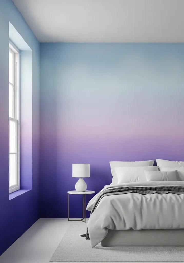 Dreamy bedroom featuring ombre gradient wall fading from dusty rose into soft cream tones, upholstered bed with layered blankets, sheer curtains glowing with sunlight, warm ambient lighting, minimal decor styling, Pinterest-inspired interior photography showing a serene, gentle atmosphere.


